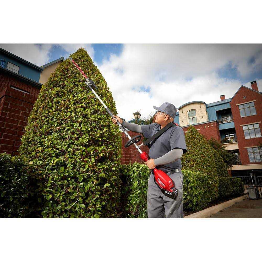 Milwaukee M18 FUEL 10 in. 18V Lithium-Ion Brushless Electric Cordless Pole Saw with M18 QUIK-LOK Hedge Trimmer Attachment